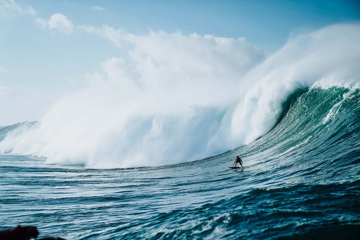 sea waves person riding on surfboard with waves behind nature